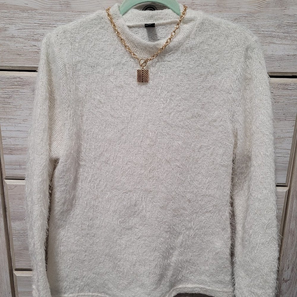 Off-white fuzzy holiday sweater snug fitting